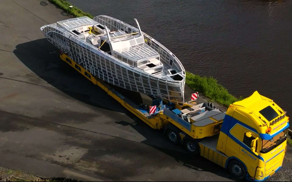 Aluminium yacht hull being transported from the yard